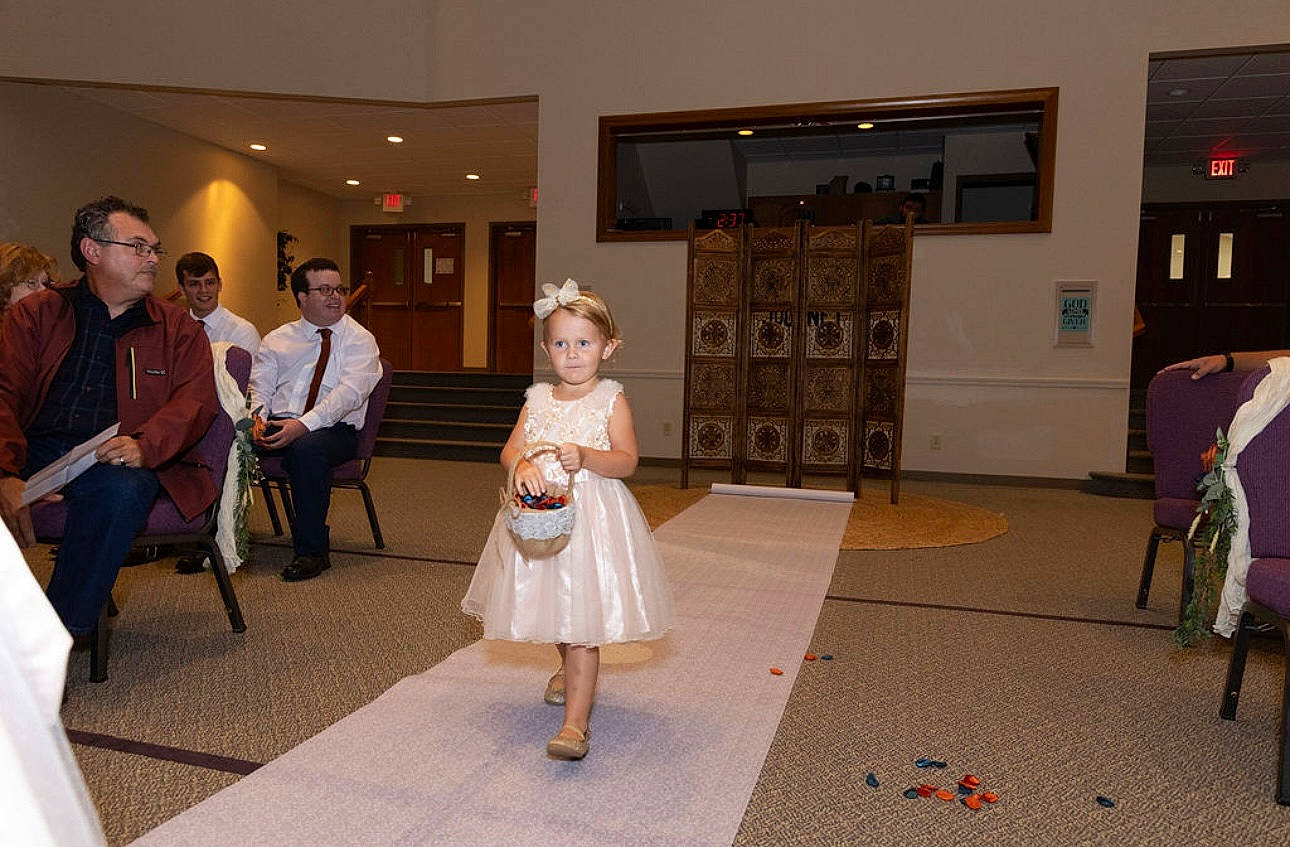 Lily is registered to the contest to win money with this photo: chair, child, entertainment, event, exhibition, fashion_design, floor, flooring, formal_wear, fun, joy, leisure, party, person, room, toddler, tourist_attraction, visual_arts