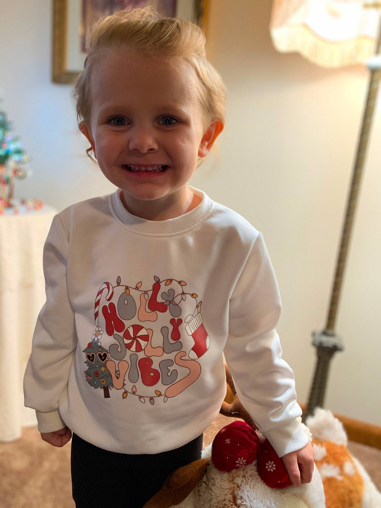 Lily is registered to the contest to win money with this photo: arm, baby, baby_toddler_clothing, child, dress, event, gelato, green, happy, joint, joy, neck, organ, pattern, person, skin, sleeve, smile, strawberry, t_shirt