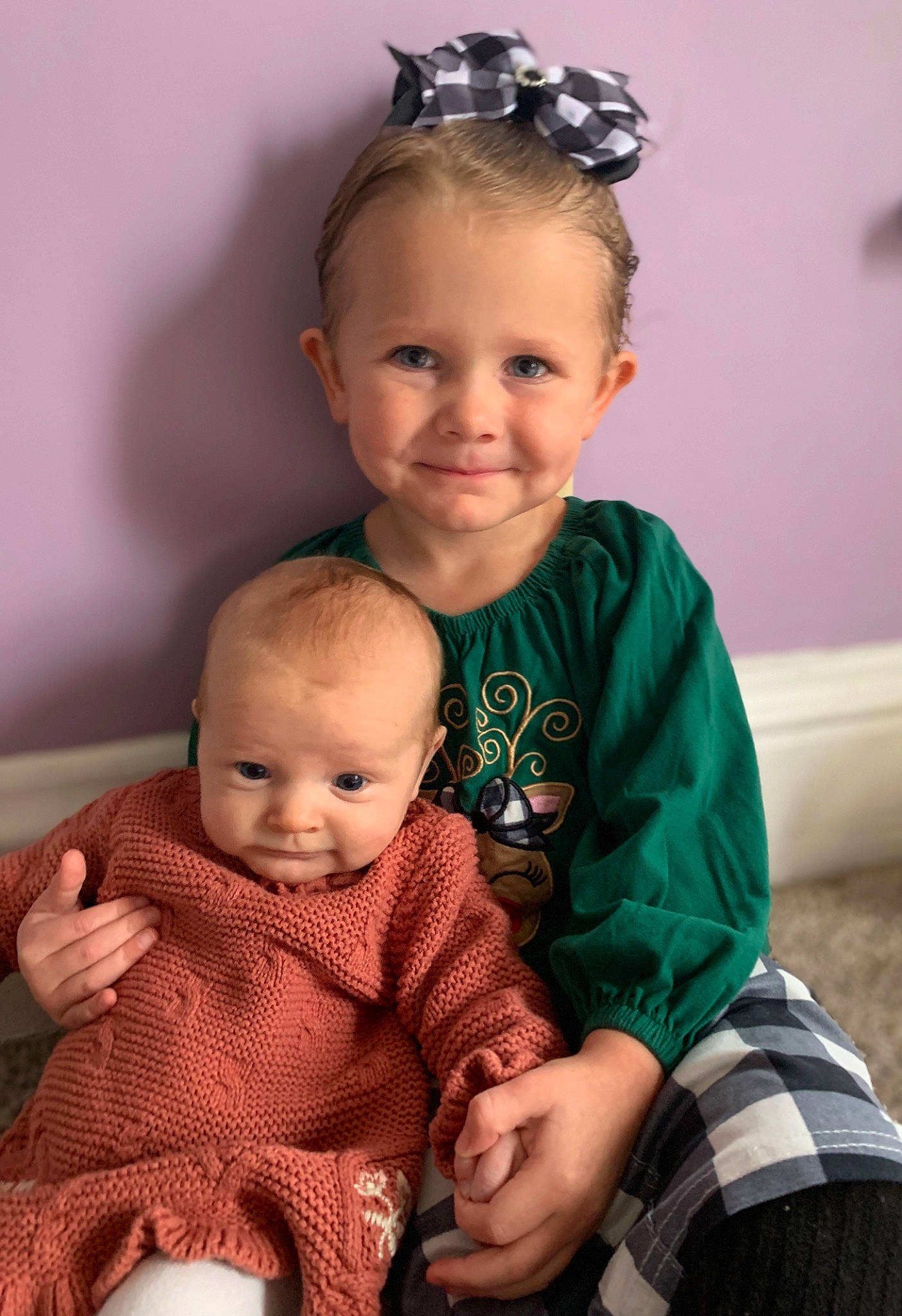 Lily is registered to the contest to win money with this photo: arm, baby, baby_toddler_clothing, cheek, chin, eye, face, facial_expression, hairstyle, hand, happy, head, iris, joy, organ, person, photograph, skin, sleeve, smile