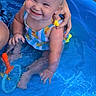 toddler, child, smiling, pool, water, swimsuit, toy, hand, blonde_hair, outdoor, summer, play, happy, cute, baby, sitting, blue, plastic_pool, nature, fun