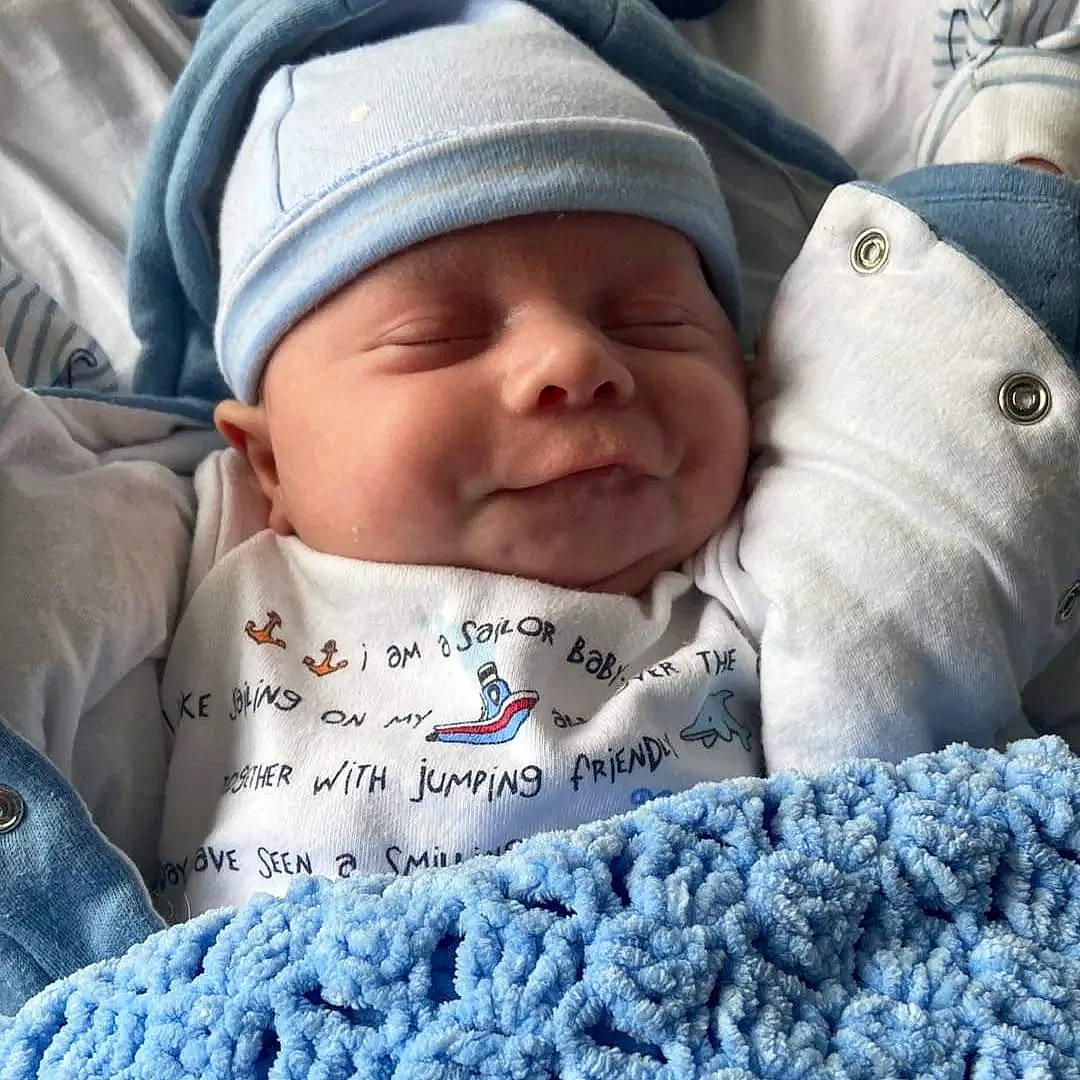 George joined the competition — help win amazing prizes! baby, baby_sleeping, child, cloud, comfort, cool, facial_expression, finger, gesture, happy, headwear, light, morning, outerwear, people, person, photograph, product, sleeve, textile