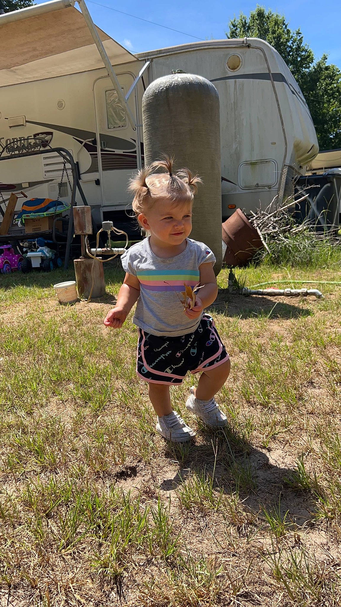 Mylee is registered to the contest to win money with this photo: child, event, fun, gas, grass, grassland, landscape, leisure, person, plant, recreation, shorts, sky, soil, t_shirt, toddler, tree, walking, yard