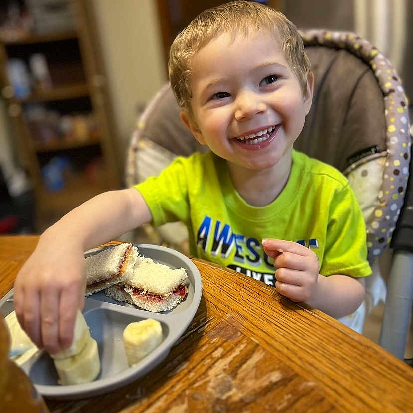Knox is registered to the contest to win money with this photo: architecture, boy, bread, brunch, child, cutlery, diningtable, dish, face, food, furniture, happy, head, male, meal, person, photography, plate, portrait, table