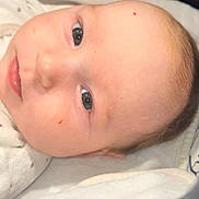 Leya participe au concours pour gagner de l'argent avec cette photo : baby, infant, face, eyes, skin, blanket, sleepwear, closeup, portrait, newborn, soft, lying_down, cute, child, head, expression, human, indoors, cozy, resting