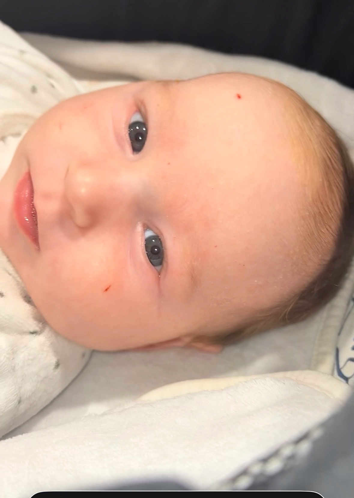 Leya participe au concours pour gagner de l'argent avec cette photo : baby, infant, face, eyes, skin, blanket, sleepwear, closeup, portrait, newborn, soft, lying_down, cute, child, head, expression, human, indoors, cozy, resting