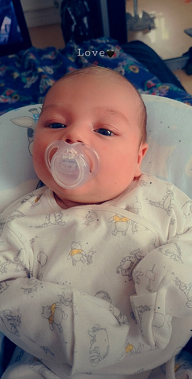 Reyn joined the competition — help win amazing prizes! baby, baby_products, baby_sleeping, baby_toddler_clothing, blue, cheek, child, comfort, eye, happy, head, iris, lip, mouth, nose, person, pink, skin, sleeve, textile