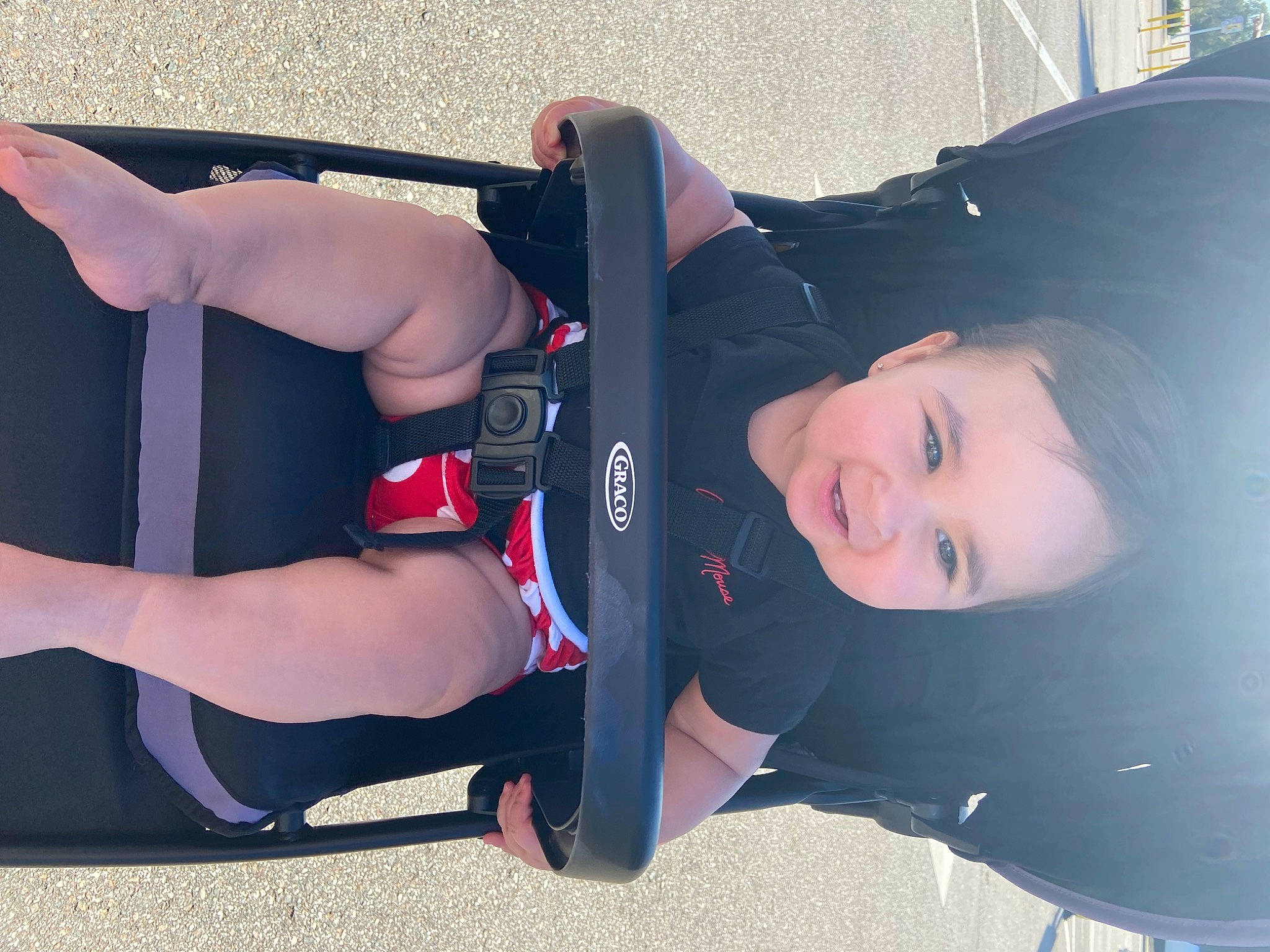 Kali is registered to the contest to win money with this photo: automotive_design, automotive_exterior, automotive_tire, automotive_wheel_system, bumper, chest, elbow, electric_blue, flash_photography, hat, human_leg, knee, person, personal_protective_equipment, shorts, smile, sportswear, thigh, toddler, trunk