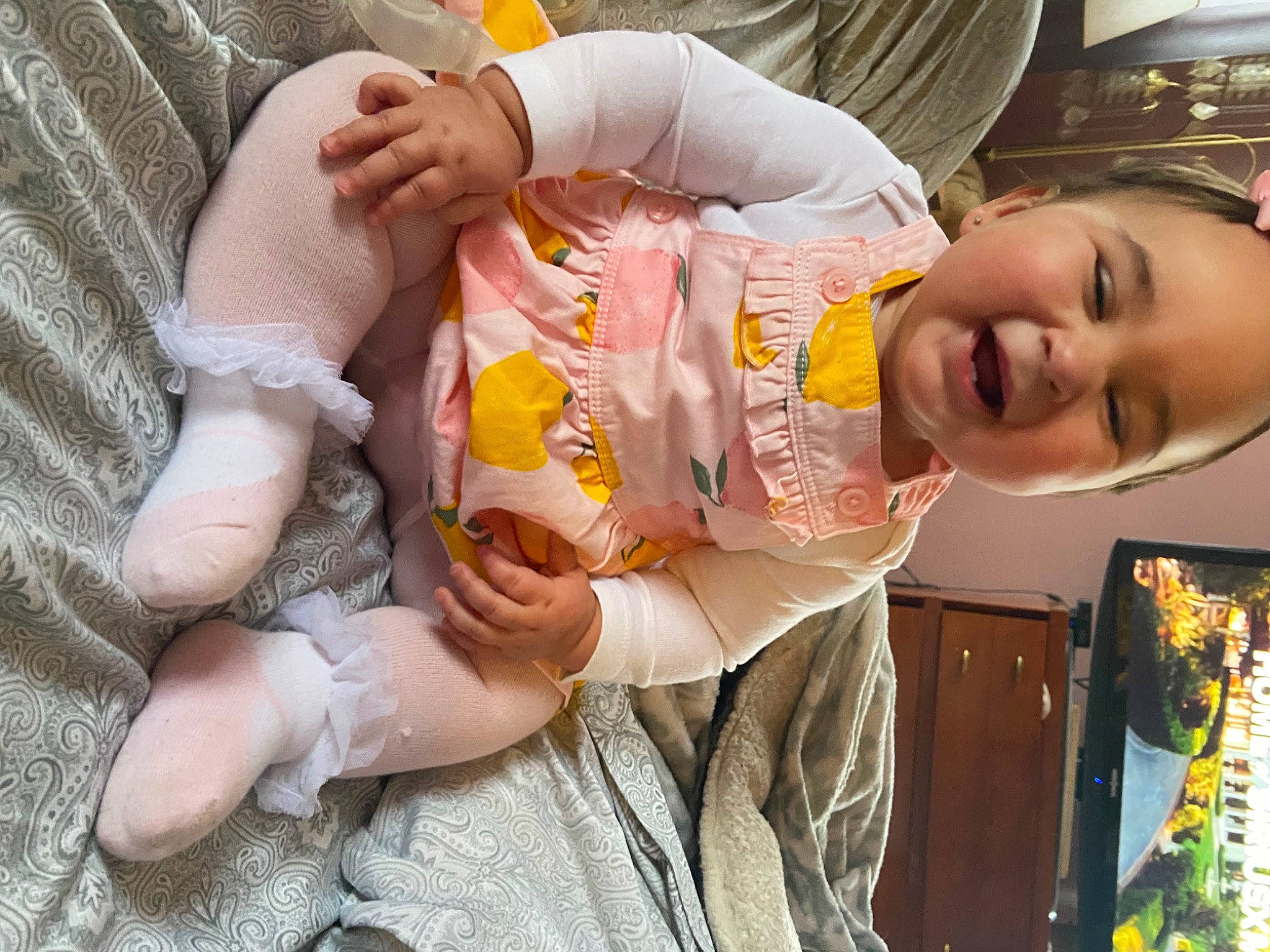 Kali is registered to the contest to win money with this photo: abdomen, baby, baby_products, baby_toddler_clothing, cheek, child, clothing, comfort, event, finger, happy, mouth, nail, nose, orange, person, skin, smile, thumb, toddler