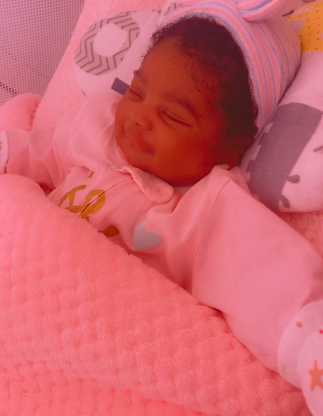 Genesis is registered to the contest to win money with this photo: baby, baby_products, baby_safety, baby_sleeping, baby_toddler_clothing, bed_sheet, bedding, bedtime, carmine, cheek, child, comfort, infant_bed, linens, magenta, nap, nose, person, pink, skin