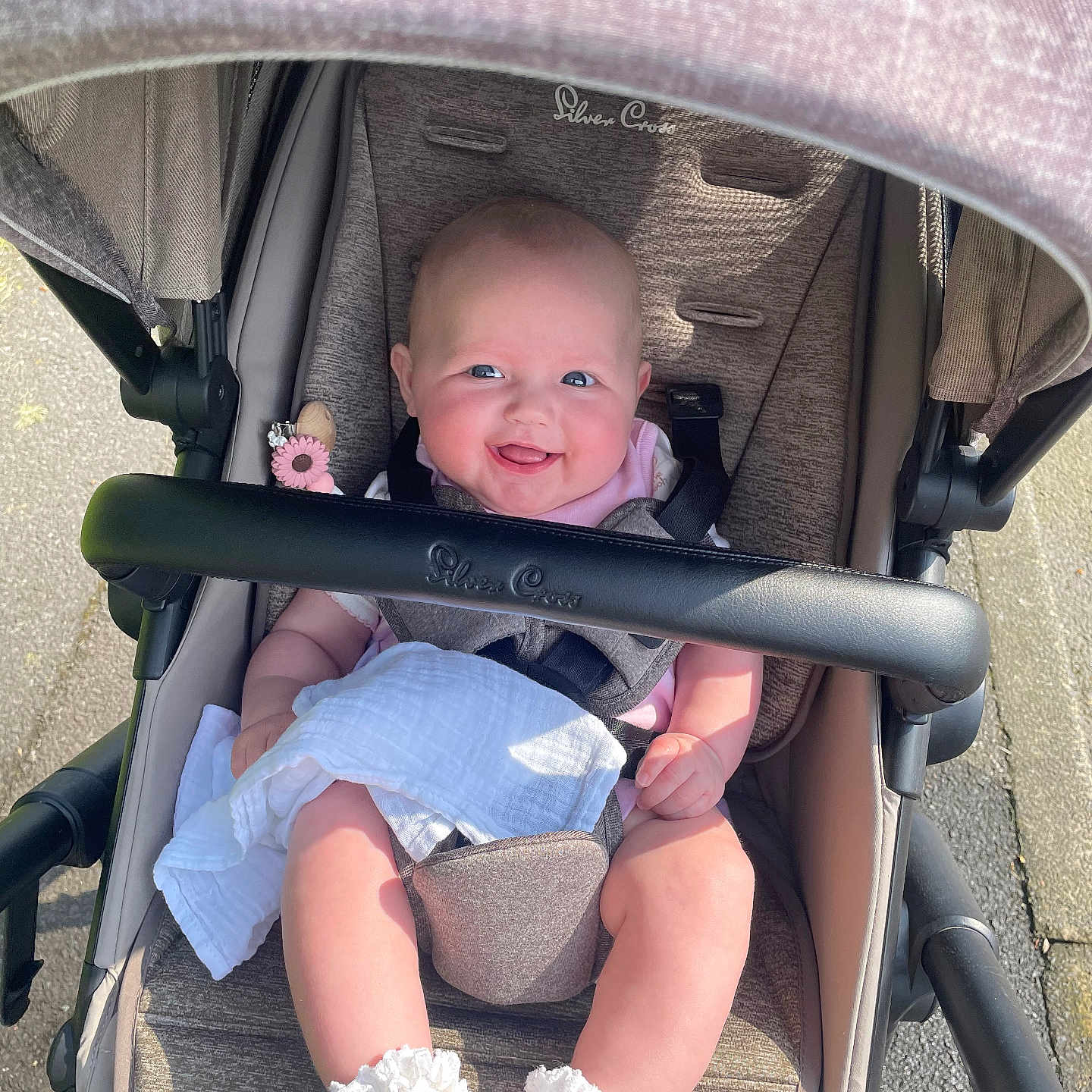 Annie joined the competition — help win amazing prizes! baby, bed, city, clothing, diaper, face, footwear, furniture, happy, head, pants, person, photography, portrait, road, shoe, shorts, street, stroller, urban