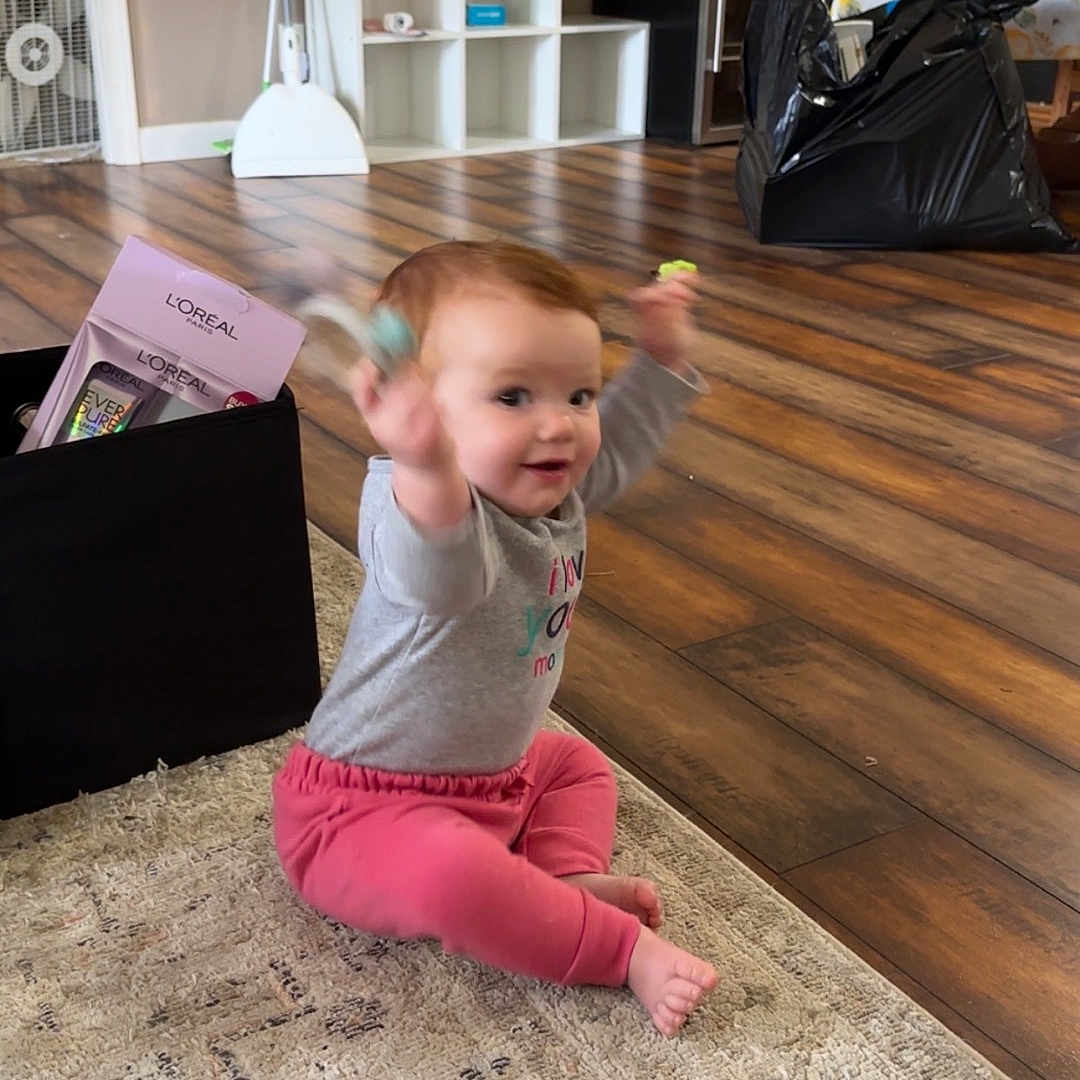 Kamrynn is registered to the contest to win money with this photo: accessories, architecture, baby, building, clothing, face, furniture, hardwood, head, indoors, interiordesign, livingroom, pants, person, photography, plant, portrait, pottedplant, room, wood