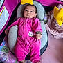 baby, infant, onesie, pink_clothing, baby_seat, cushion, playpen, yellow_star_toy, blanket, soft_toys, indoor, child, cute, face, feet, looking_up, comfort, resting, patterned_blanket, colorful