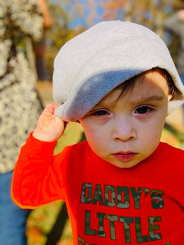 Silas is registered to the contest to win money with this photo: baseball_cap, cap, child, chin, electric_blue, eye, finger, fun, gesture, happy, headgear, headwear, leisure, lip, outerwear, people, people_in_nature, person, skin, sleeve