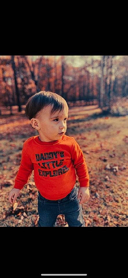 Silas is registered to the contest to win money with this photo: baby, baby_toddler_clothing, child, flash_photography, fun, grass, hair, happy, leisure, orange, people_in_nature, person, plant, play, portrait_photography, sitting, sleeve, tints_and_shades, toddler, tree
