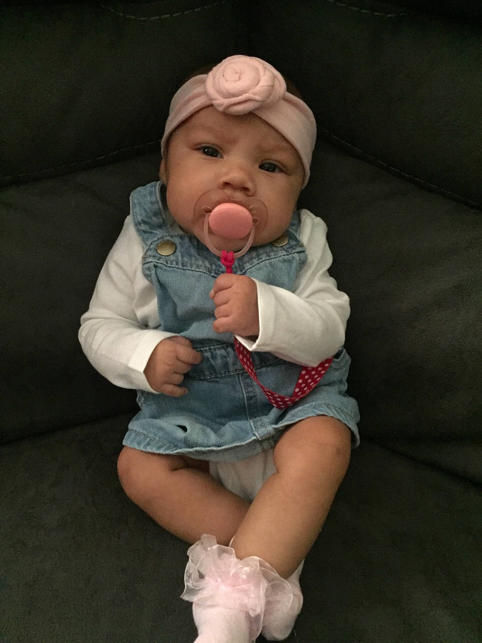 Emire is registered to the contest to win money with this photo: arm, baby, baby_products, baby_toddler_clothing, cheek, comfort, eye, hand, head, headwear, human_body, human_leg, knee, mouth, nose, person, skin, sleeve, thigh, thumb