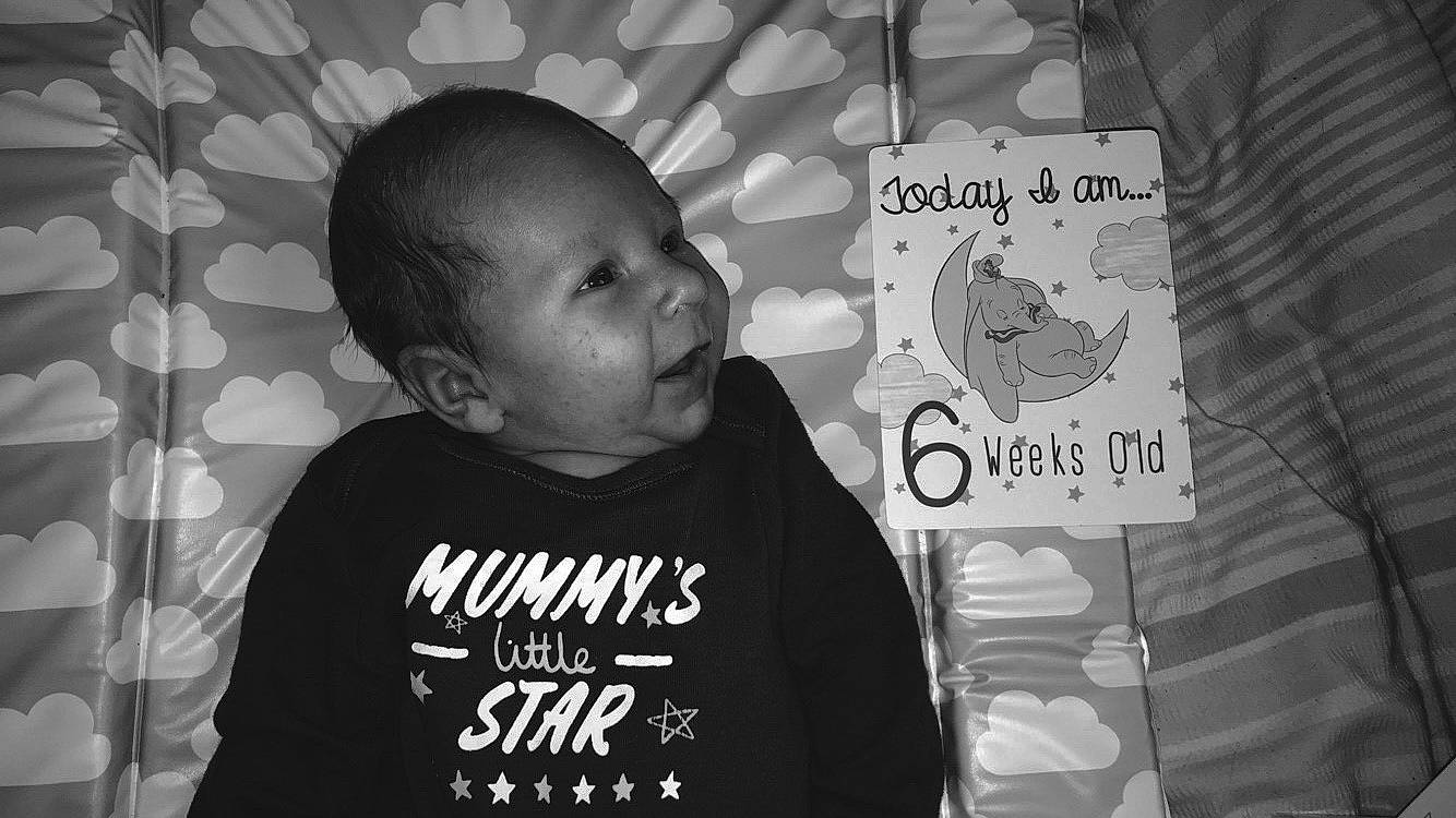 Dion is registered to the contest to win money with this photo: baby, black, black_and_white, cheek, child, cool, font, forehead, monochrome, monochrome_photography, person, photography, product, style, t_shirt, text, toddler, top, white, world