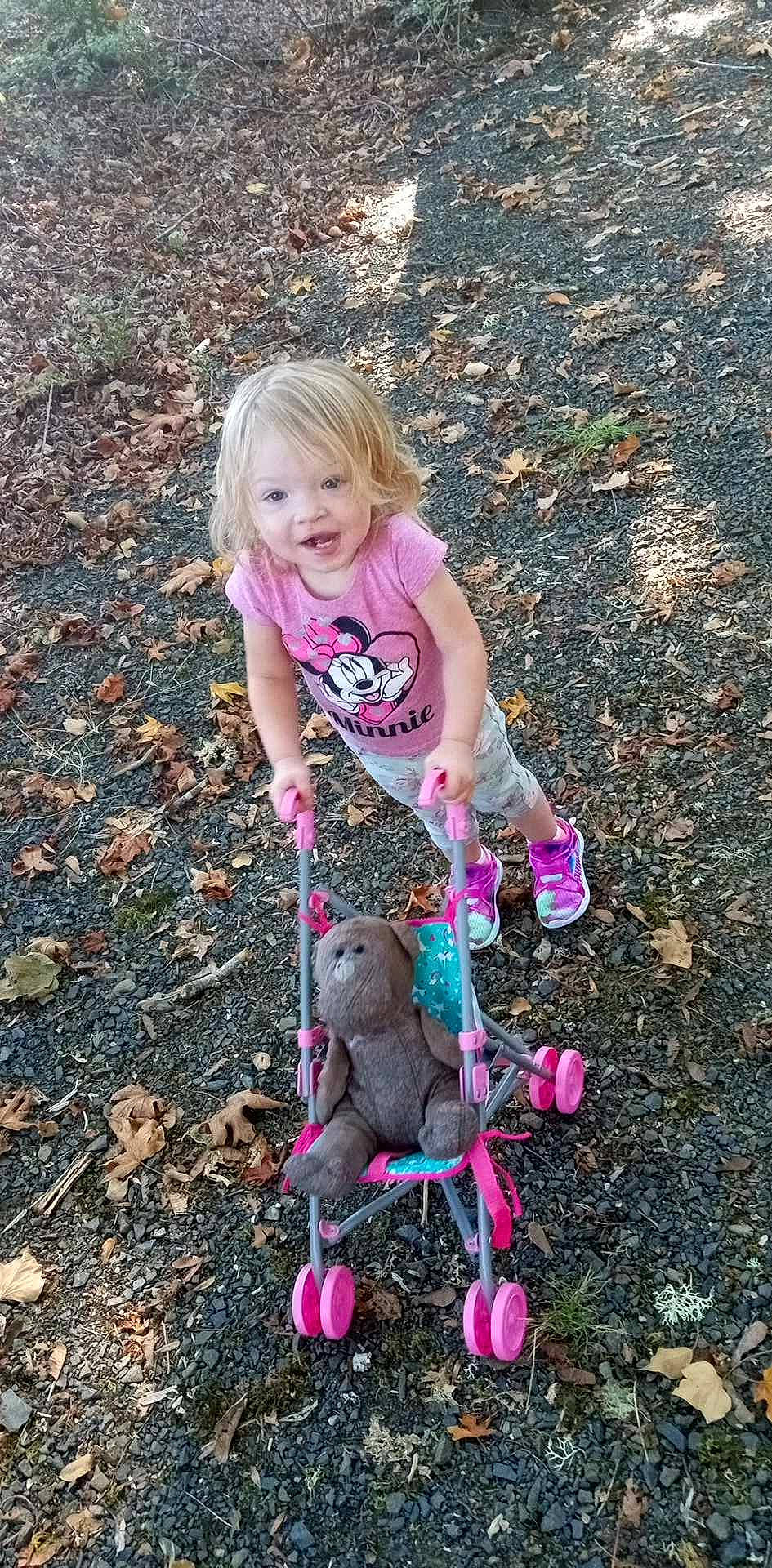 Harlee joined the competition — help win amazing prizes! baby_toddler_clothing, child, fashion_accessory, fun, grass, happy, magenta, people_in_nature, person, pink, plant, play, sitting, smile, soil, t_shirt, tail, toddler, toy