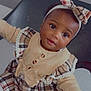toddler, child, girl, headband, plaid, dress, buttons, ruffles, sitting, chair, white_tights, shoes, cute, portrait, indoor, smiling, happy, fashion, baby, young_child