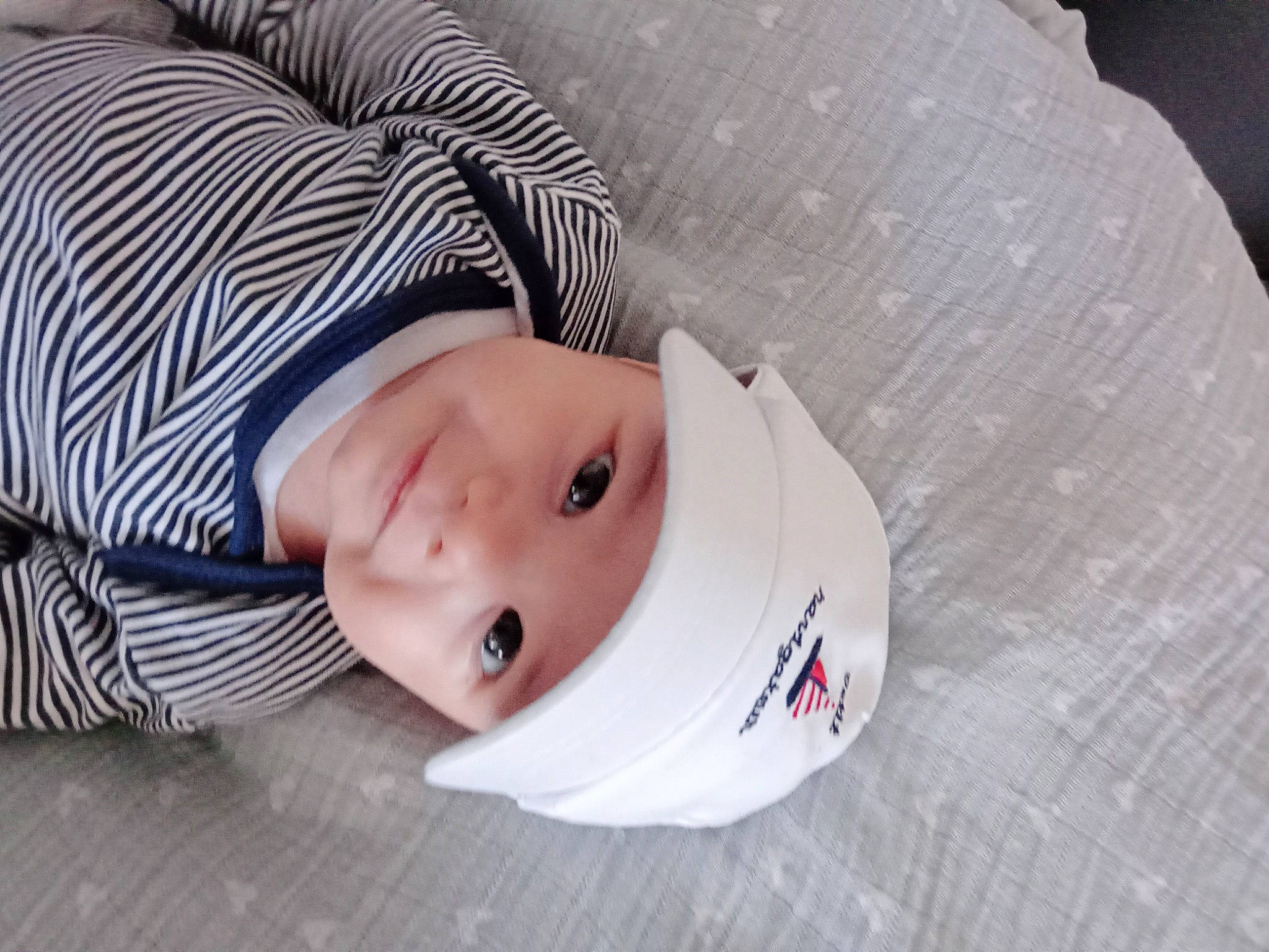 Gaspard a rejoint le concours — aidez-le/la à gagner de superbes lots ! baby, baby_toddler_clothing, cap, child, collar, comfort, eye, eyelash, fashion_accessory, hat, headgear, headwear, lip, pattern, person, portrait_photography, skin, sleeve, street_fashion, toddler