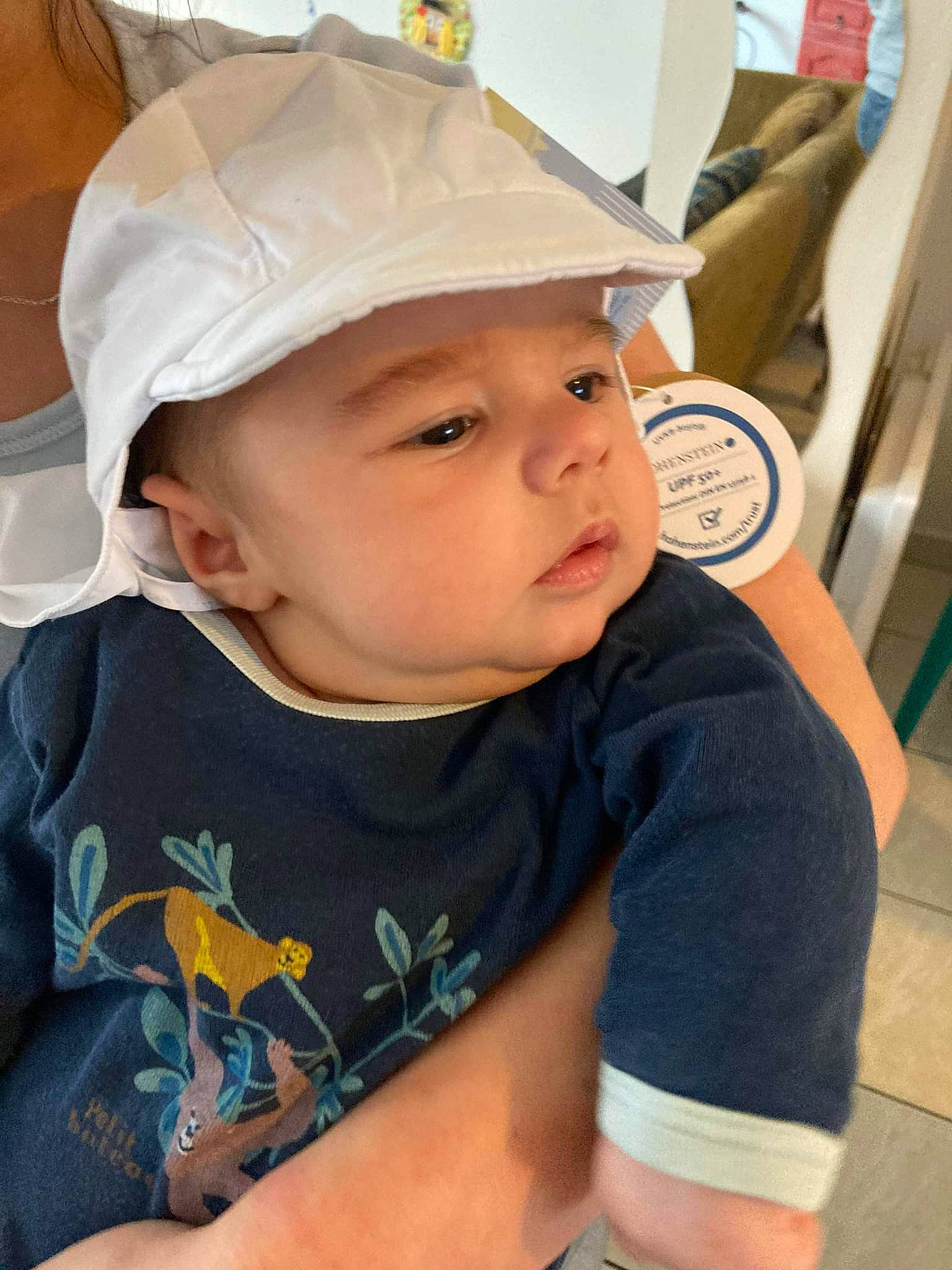 Gaspard participe au concours pour gagner de l'argent avec cette photo : baby, baby_toddler_clothing, baseball_cap, cap, cheek, child, chin, cricket_cap, electric_blue, fashion_accessory, forehead, fun, hairstyle, headwear, person, personal_protective_equipment, product, skin, sleeve, t_shirt