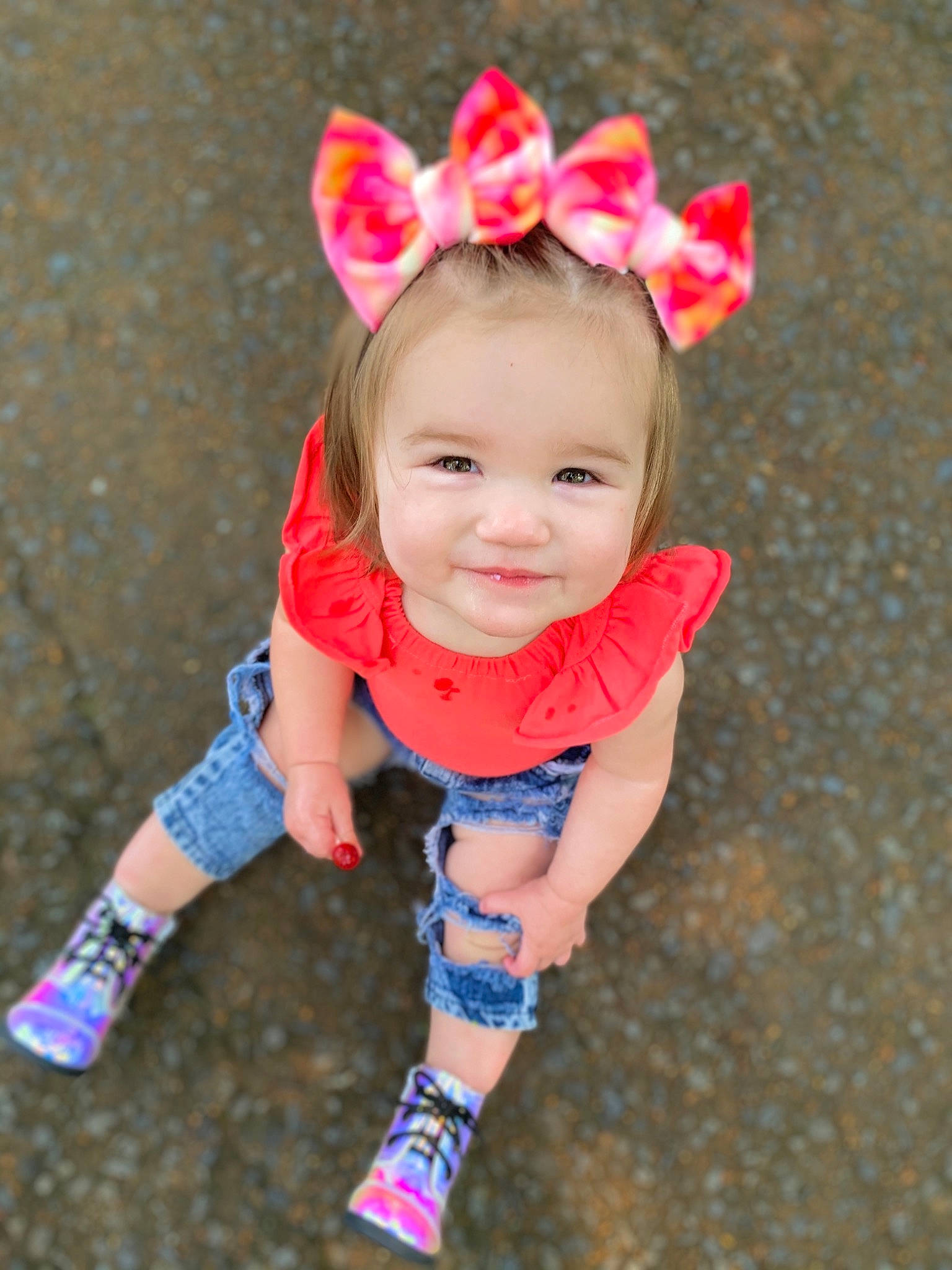 Ruby Cate is registered to the contest to win money with this photo: baby, baby_toddler_clothing, child, dress, eye, face, grass, happy, head, headband, headpiece, human_body, joy, magenta, pattern, person, petal, pink, skin, sleeve
