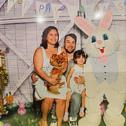 Kalani is registered to the contest to win money with this photo: family, woman, man, child, dog, easter_bunny, costume, smile, celebration, bunting, decorations, indoor, holiday, pet, happy, posing, event, people, spring, festive