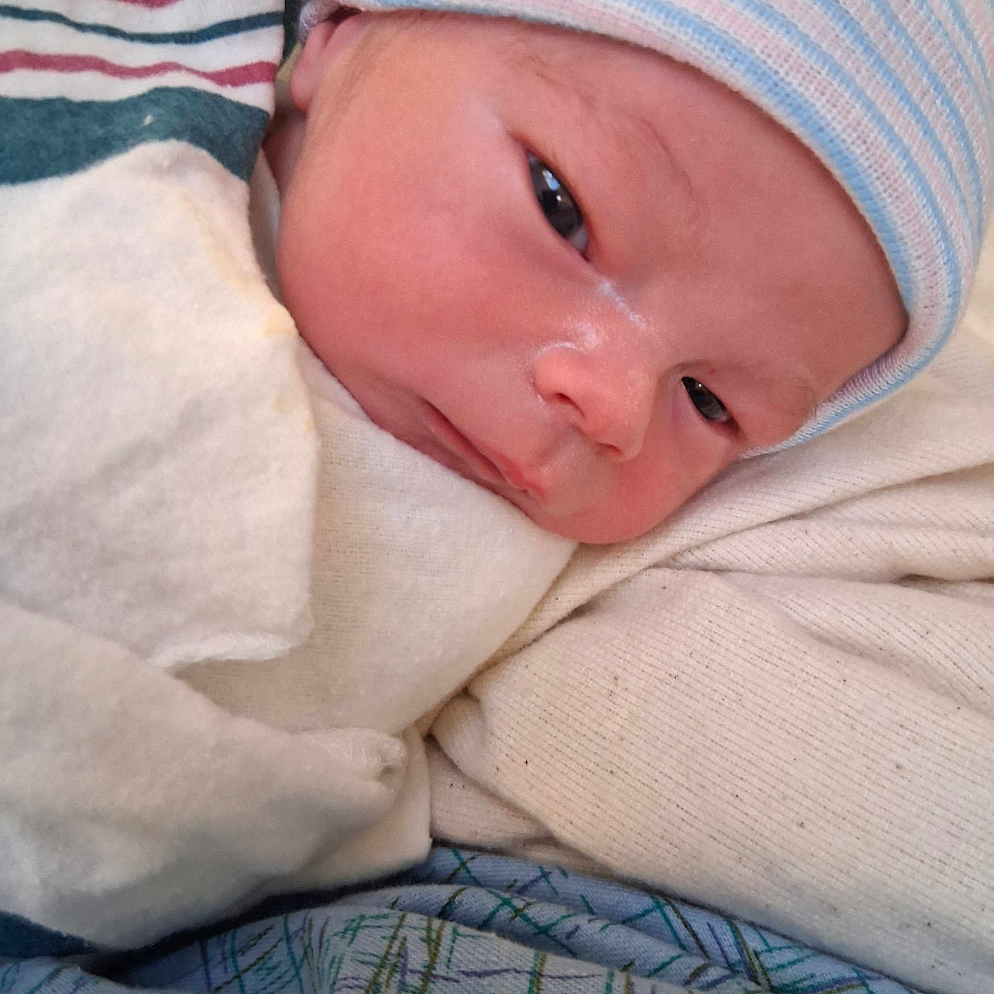 Jw is registered to the contest to win money with this photo: newborn, baby, infant, face, hat, blanket, sleepy, wrapped, soft, cute, human, child, portrait, closeup, newborn_hat, baby_clothes, resting, indoors, skin, person