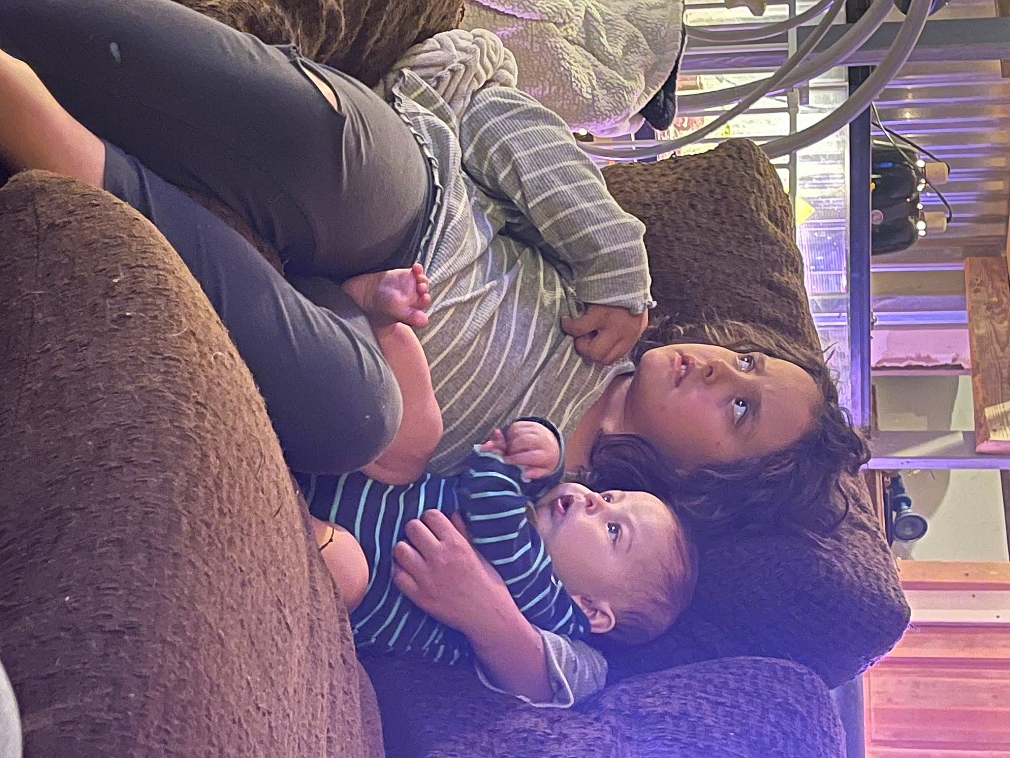 Jay is registered to the contest to win money with this photo: abdomen, baby, comfort, elbow, eyewear, flash_photography, hat, human_leg, interaction, jeans, joint, knee, leg, mammal, person, purple, sunglasses, thigh, toddler, tree