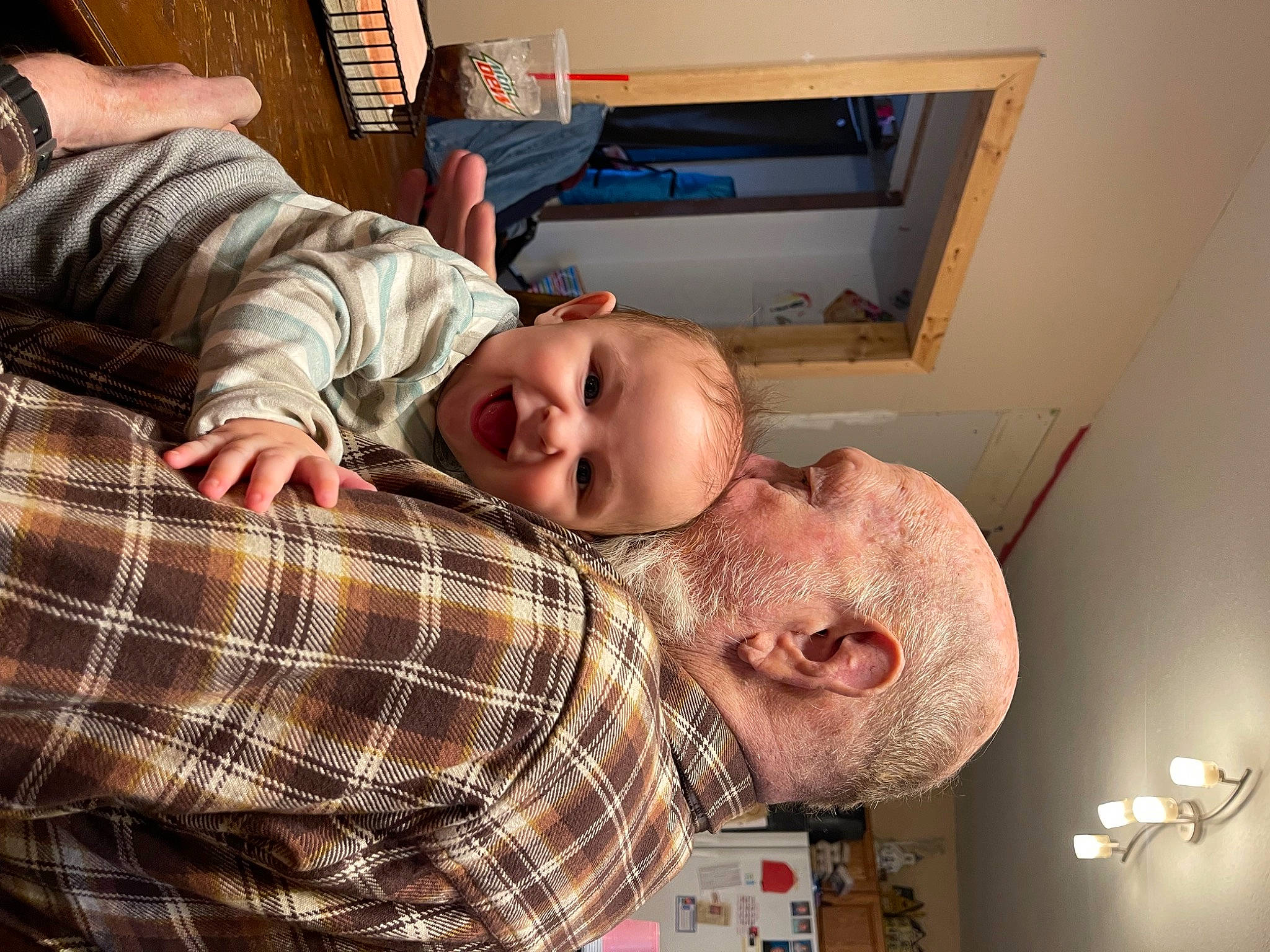 Jay joined the competition — help win amazing prizes! baby, beard, child, comfort, fun, happy, hat, lap, light_fixture, pattern, person, picture_frame, plaid, room, sitting, smile, tartan, toddler, wood