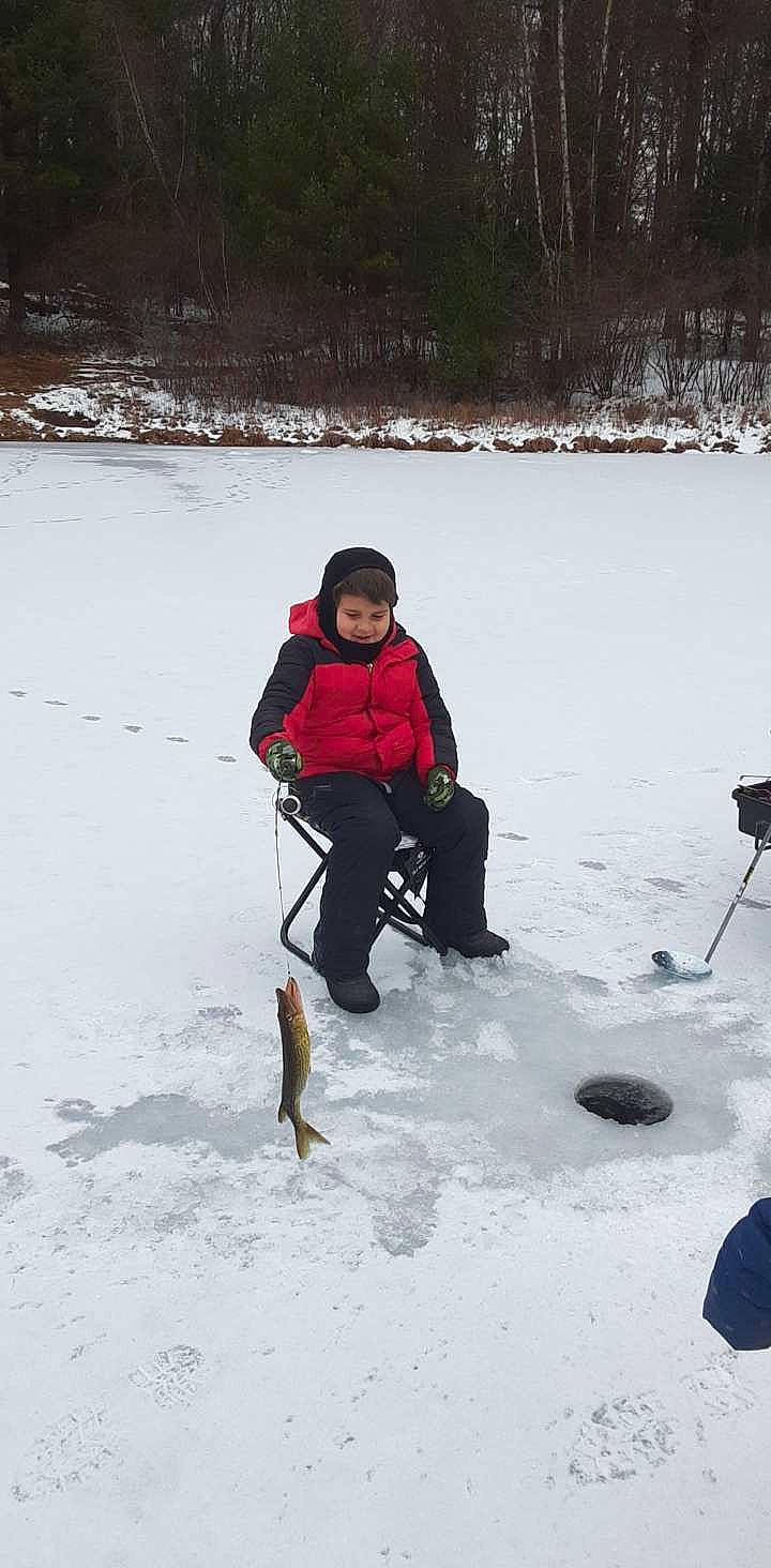 Jayden is registered to the contest to win money with this photo: boot, carnivore, dog, dog_hiking, freezing, fun, geological_phenomenon, glacial_landform, ice_cap, leash, mountaineer, person, playing_in_the_snow, recreation, ski_equipment, ski_pole, slope, snow, sporting_group, winter