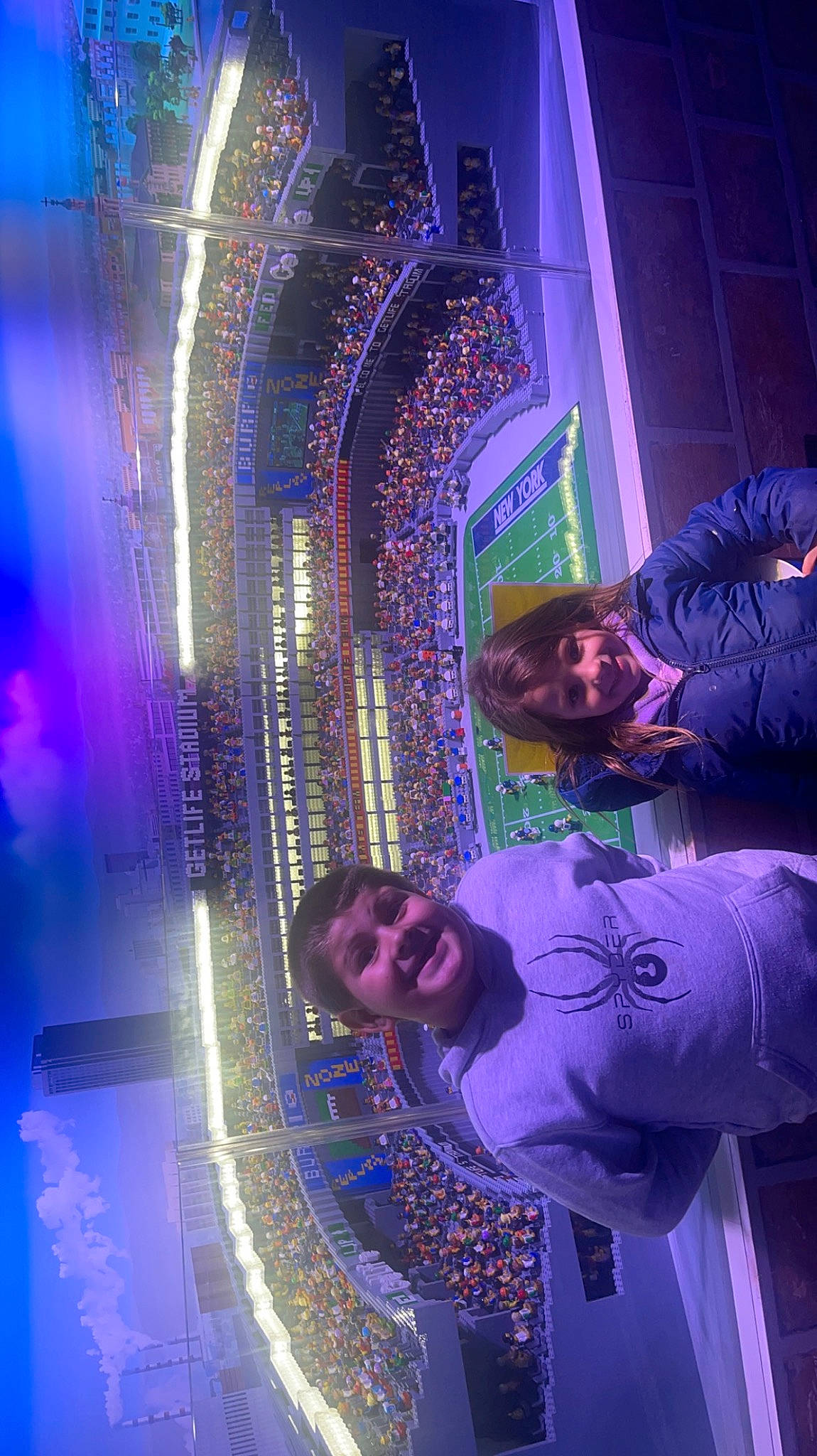 Jayden joined the competition — help win amazing prizes! building, electric_blue, electricity, entertainment, event, eyewear, fun, glass, joy, leisure, light, lighting, magenta, neon, night, person, purple, smile, space, violet