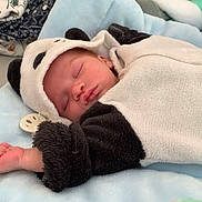 Mattya participe au concours pour gagner de l'argent avec cette photo : baby, sleeping, panda_onesie, blanket, soft, nursery, infant, cute, clothing, face, peaceful, child, indoors, rest, cozy, bed, toddler, cute_outfit, baby_clothes, relaxation