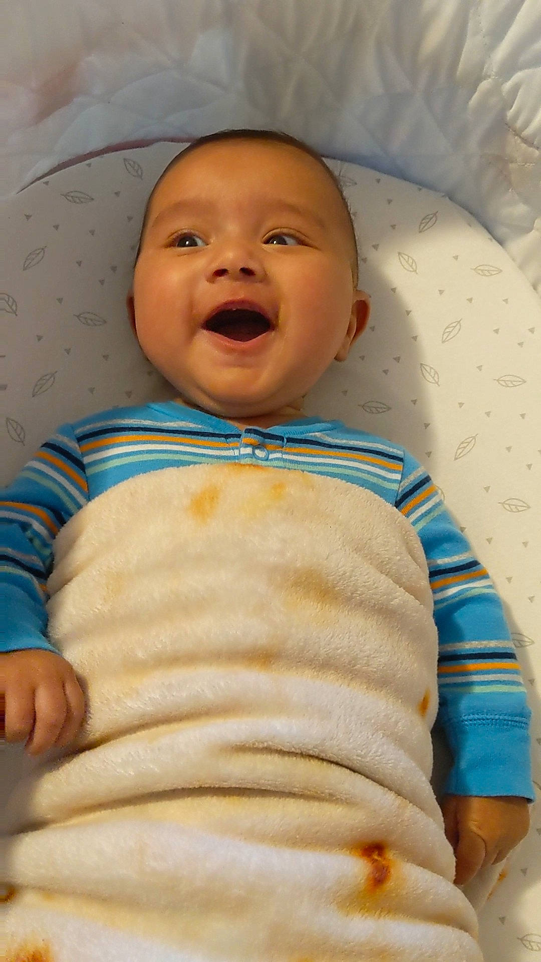 Teddy is registered to the contest to win money with this photo: baby, baby_products, baby_toddler_clothing, cheek, child, facial_expression, iris, laugh, linens, lip, mouth, nose, organ, person, skin, sleeve, sweater, toddler, tongue, tooth