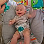 Aurora joined the competition — help win amazing prizes! baby, infant, smiling, baby_seat, toy, hand, elephant_toy, monkey_decoration, carpet, clothing, striped_shirt, playful, happy, indoor, child, cute, reaching, feet, seatbelt, colorful