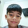 Aariz is registered to the contest to win money with this photo: background, boy, casual, ceiling, child, cute, face, happy, head_and_shoulders, home, indoor, light_skin, portrait, selfie, short_hair, smile, striped_shirt, tv, wall, young