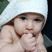 Aariz joined the competition — help win amazing prizes! baby, child, chubby, closeup, cute, expression, eyes, face, hand, holding, hood, indoor, infant, person, portrait, skin, soft_texture, sucking, thumb, towel