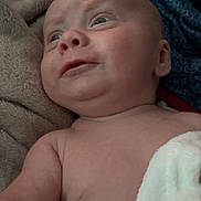 Carter joined the competition — help win amazing prizes! baby, infant, blanket, closeup, skin, face, expression, blue_eyes, soft_texture, fabric, cozy, newborn, child, portrait, lying_down, human, indoors, nap, cute, tender