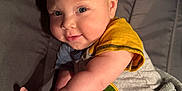 Kohen joined the competition — help win amazing prizes! baby, child, infant, smile, face, arm, blanket, shirt, blue_eyes, mohawk_hairstyle, lying_down, cozy, soft, cute, indoors, person, skin, happy, toddler, portrait