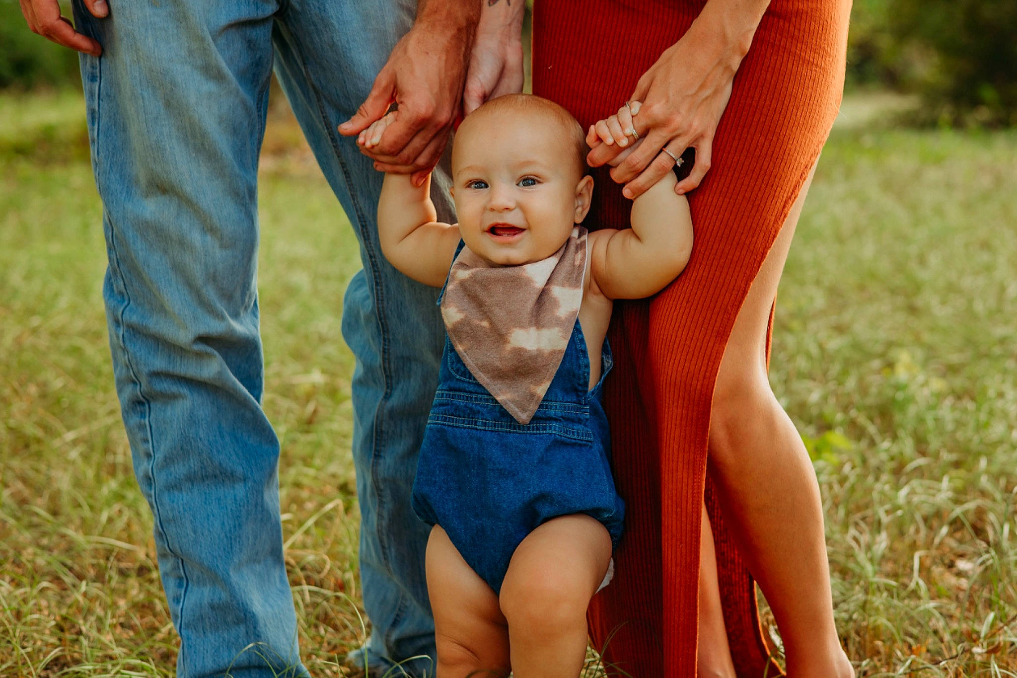 River is registered to the contest to win money with this photo: baby, eye, finger, fun, gesture, grass, hand, happy, head, human_body, leg, leisure, people_in_nature, person, plant, smile, summer, sunlight, thigh, thumb