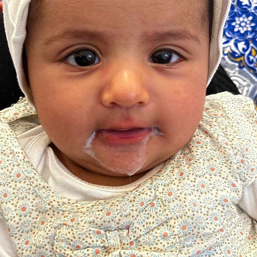 Alisa participe au concours pour gagner de l'argent avec cette photo : baby, baseballcap, bodypart, bonnet, cap, clothing, coat, cutlery, face, happy, hat, head, jacket, mouth, person, photography, portrait, smile, spitting, spoon