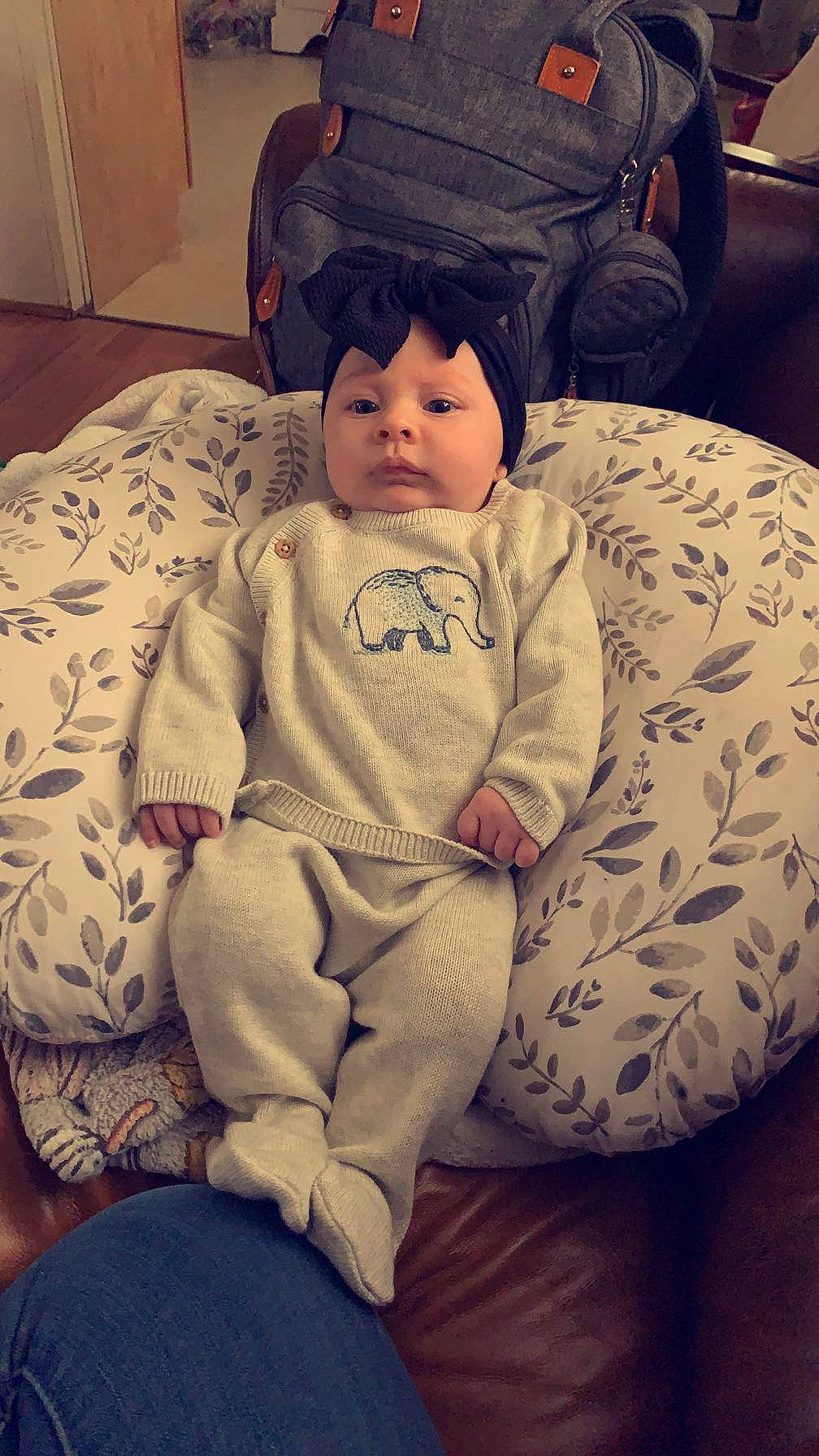 Emersyn joined the competition — help win amazing prizes! baby, baby_toddler_clothing, chair, cheek, child, comfort, couch, eye, eyewear, face, fur, happy, hat, lap, person, personal_protective_equipment, room, selfie, sitting, sleeve