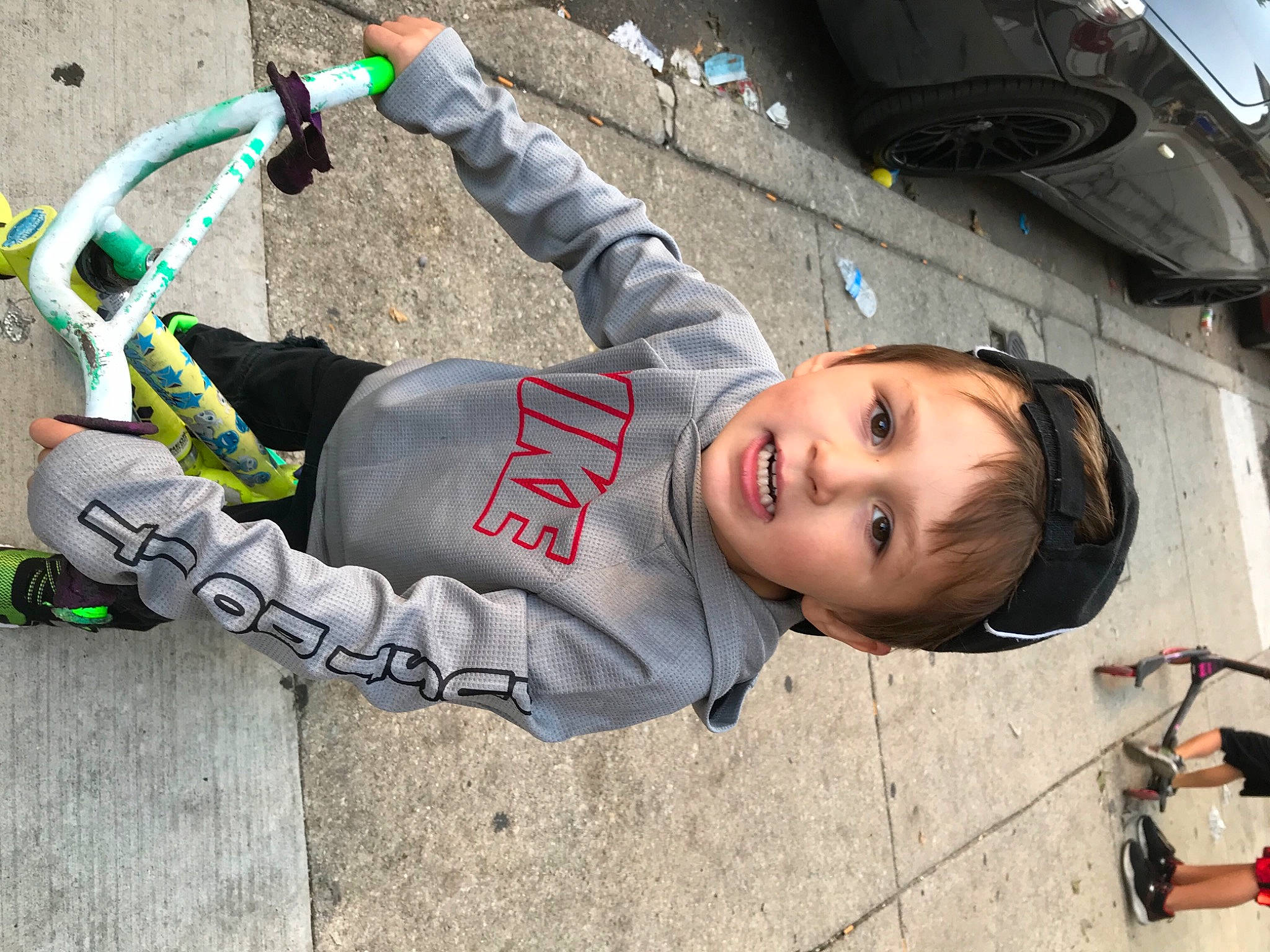 Rocky joined the competition — help win amazing prizes! asphalt, auto_part, automotive_design, automotive_tire, automotive_wheel_system, child, cool, fashion_accessory, fun, pattern, person, personal_protective_equipment, smile, street, street_fashion, tire, toddler, tree, vehicle, vehicle_door