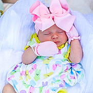 Blakely joined the competition — help win amazing prizes! baby, sleeping, pink_bow, mittens, colorful_clothing, bunny_pattern, yellow_shorts, white_socks, soft_fabric, newborn, cute, peaceful, infant, headband, portrait, child, resting, adorable, one_person, indoors