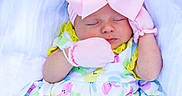 Blakely joined the competition — help win amazing prizes! adorable, baby, bunny_pattern, child, colorful_clothing, cute, headband, indoors, infant, mittens, newborn, one_person, peaceful, pink_bow, portrait, resting, sleeping, soft_fabric, white_socks, yellow_shorts