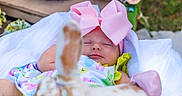 Blakely is registered to the contest to win money with this photo: baby, bow, sleeping, blanket, bunny, toy, teddy_bear, flowers, spring, basket, greenery, pink, white, cute, child, infant, soft, resting, decor, colorful