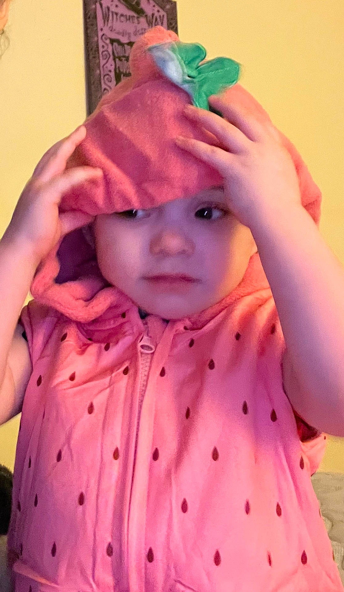 Miracle joined the competition — help win amazing prizes! apparel, baby, child, clothing, cozy, curious, cute, expression, face, hands, hood, hoodie, indoor, person, pink, playful, portrait, strawberry, toddler, young_child