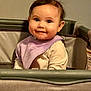 Raiden is registered to the contest to win money with this photo: baby, child, infant, playpen, bib, smile, cute, indoor, clothing, face, person, sitting, happy, young, small, eyes, hair, sleeve, cozy, portrait