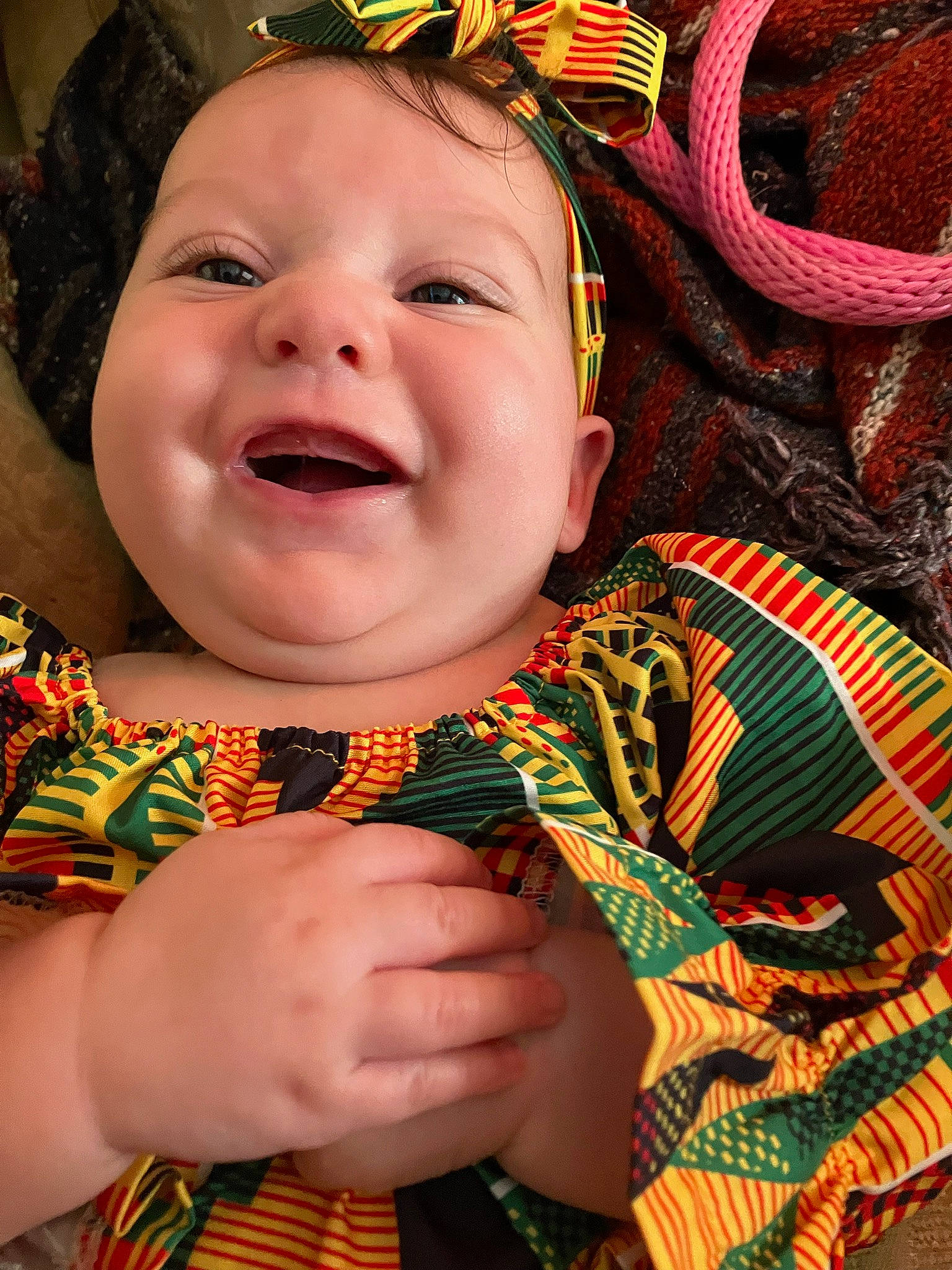 Viviana is registered to the contest to win money with this photo: baby, cheek, child, event, fashion_accessory, fun, green, happy, laugh, pattern, peach, people_in_nature, person, skin, smile, toddler, tradition