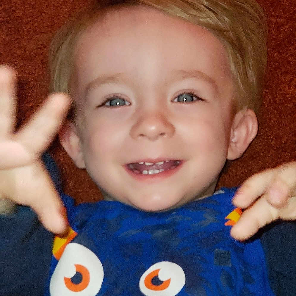 Arley is registered to the contest to win money with this photo: baby, blue, cheek, child, chin, ear, eye, face, facial_expression, finger, fun, head, iris, joy, lip, mouth, nose, organ, person, skin