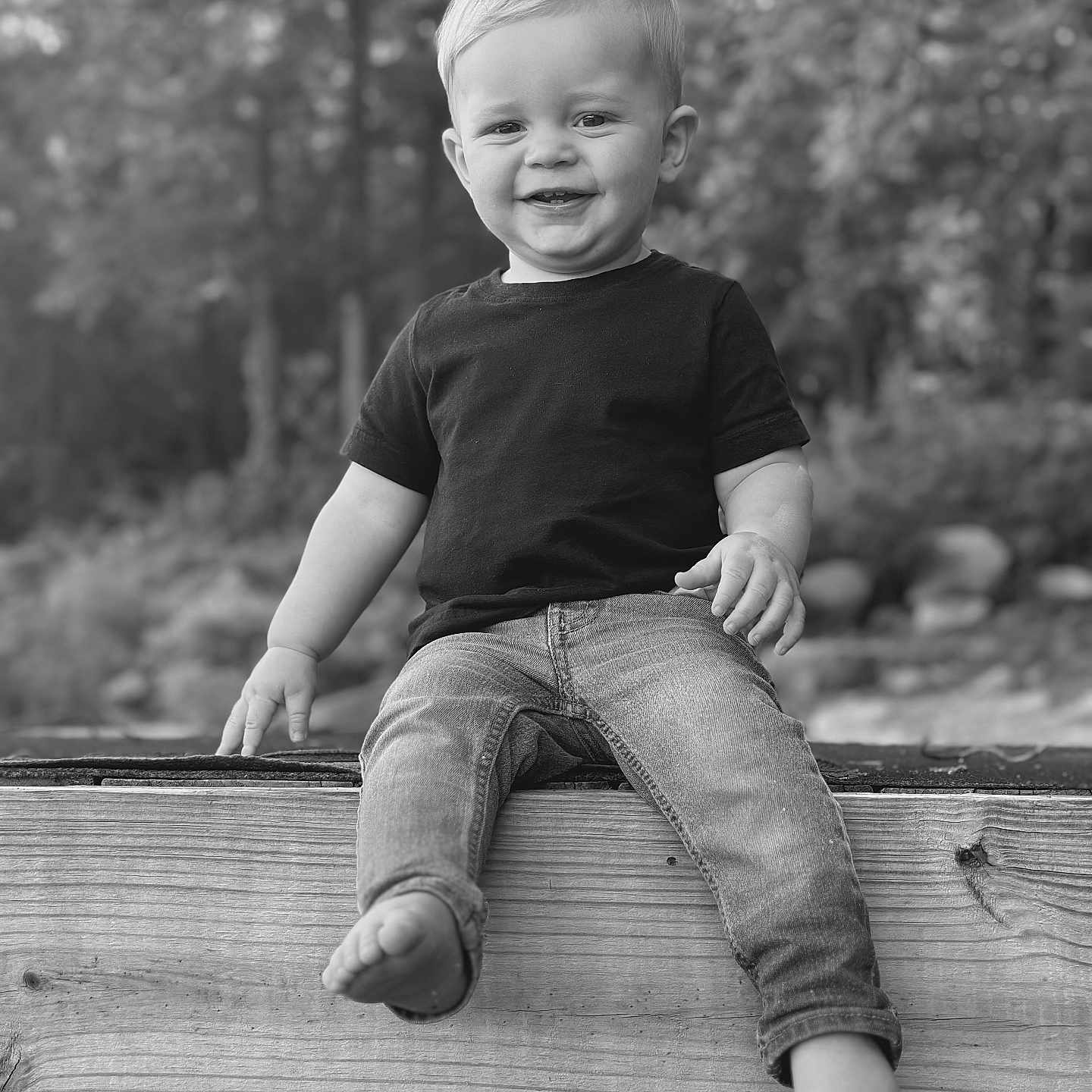 Trent is registered to the contest to win money with this photo: baby, bodypart, clothing, face, finger, footwear, hand, happy, head, jeans, pants, person, photography, plant, portrait, shoe, sitting, smile, tree, wood